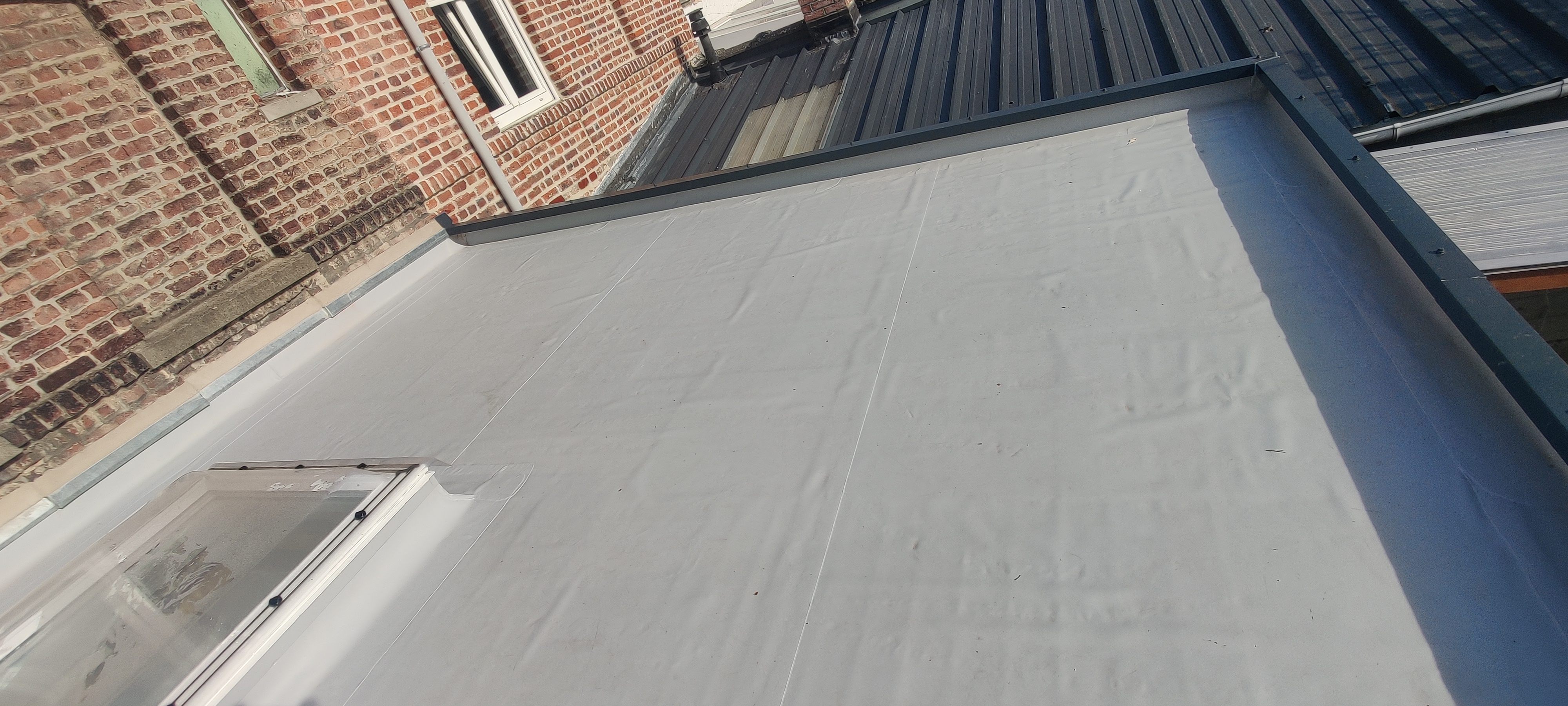 Rénovation toiture plate Croix