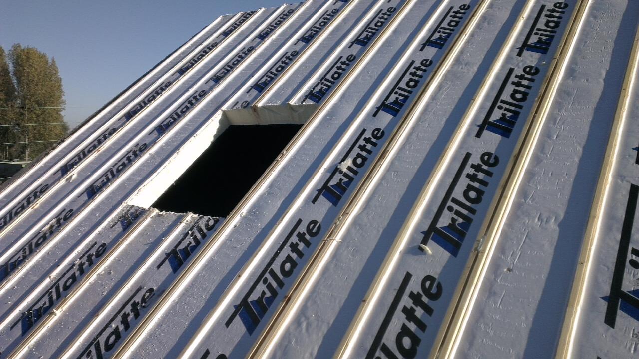 Isolation de toiture par sarking installée pour améliorer le confort thermique du logement à Lecelles