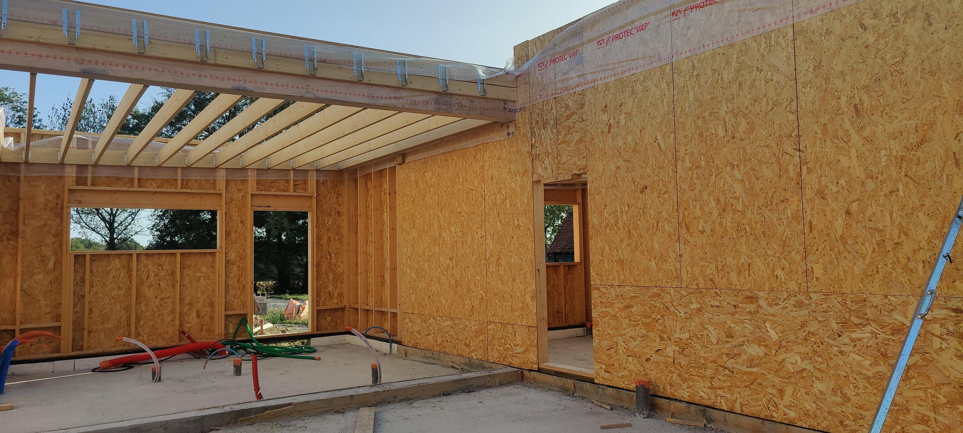 extension d une maison en ossature bois sur merignies avec toiture plate en membrane